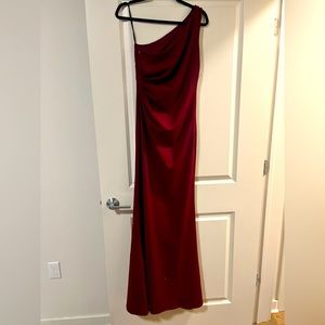 Brand new with tag. Burgundy long formal dress. Size 4